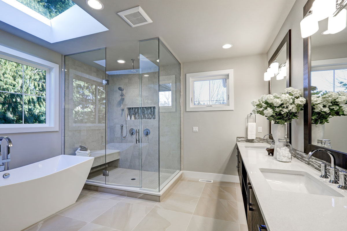 Example of full remodel bathroom featuring updated fixtures and lighting